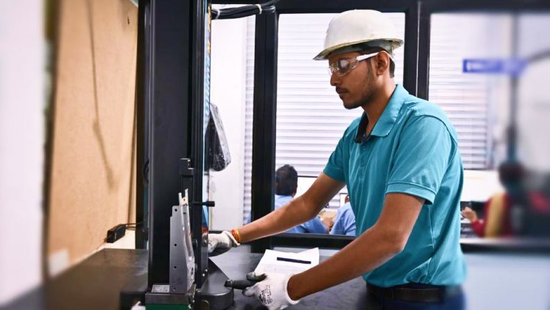 Engineer at a CNC control panel