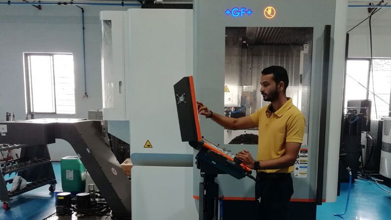 Wind Chisel machinist operating a CNC machining centre